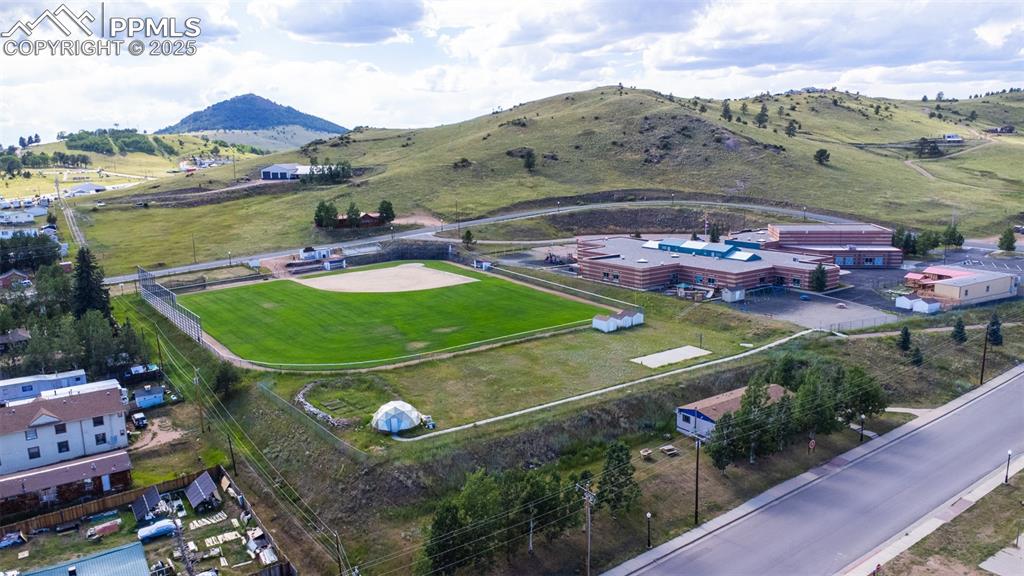 Image 28 of 34: View of rural area with a mountainous background