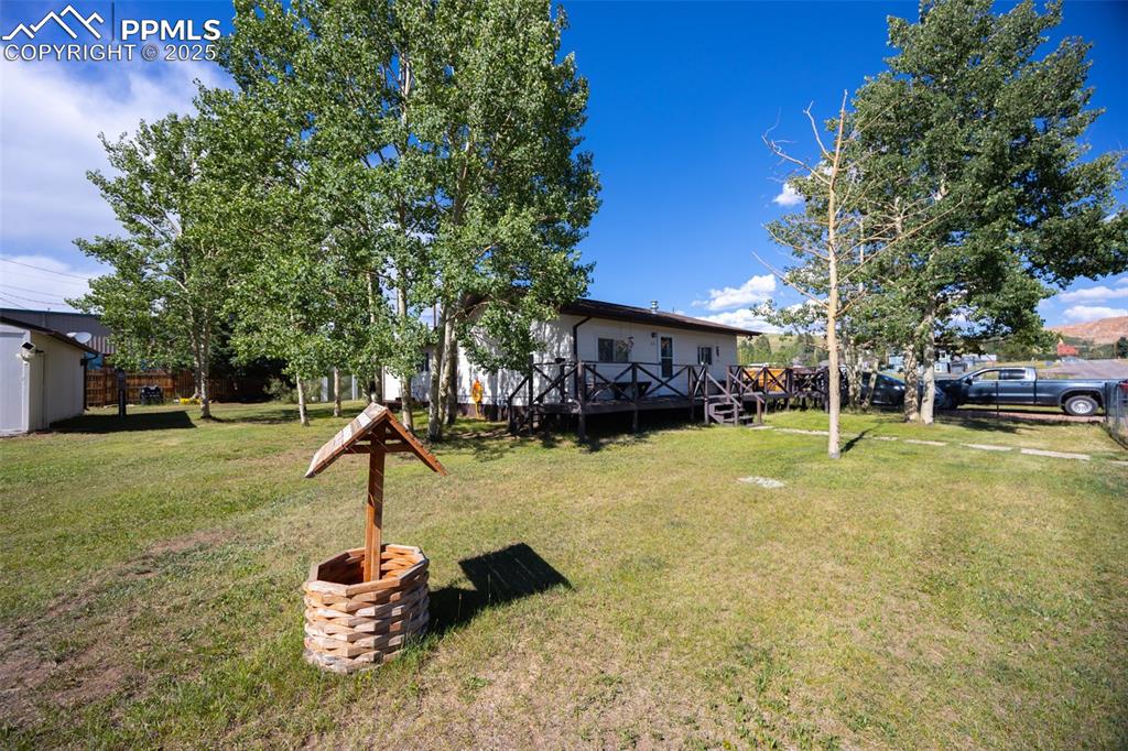 Image 3 of 34: View of yard with a deck