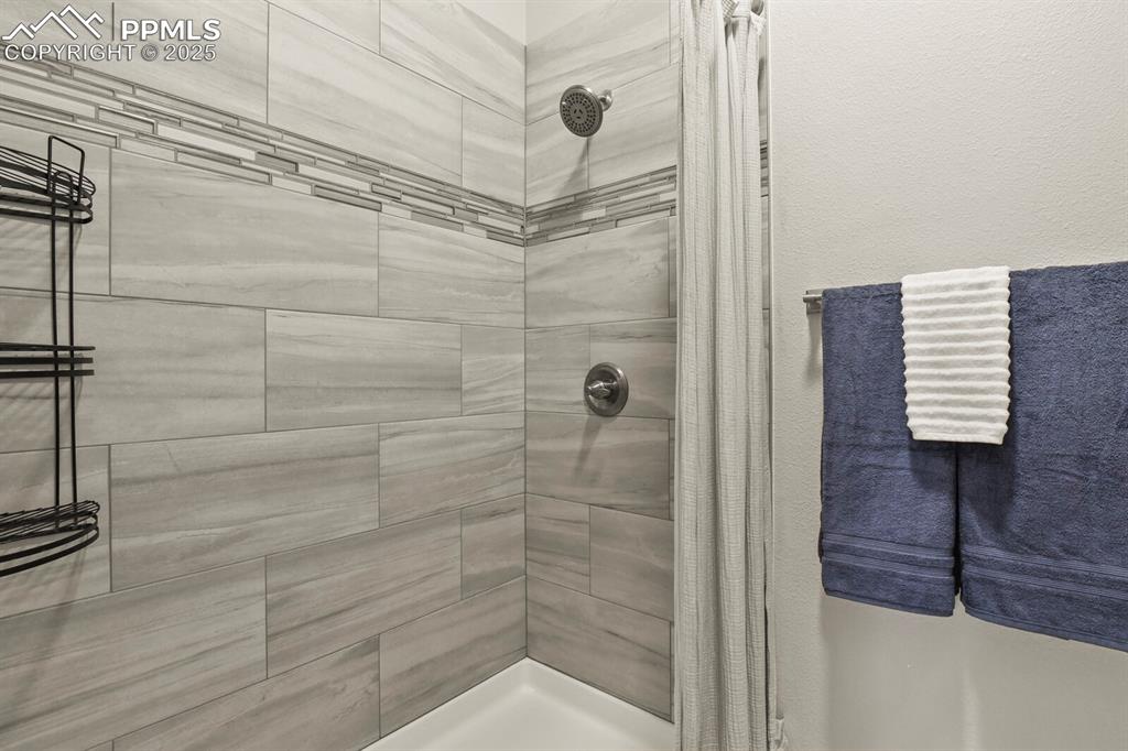 Image 26 of 44: Workout room with a sink, carpet, and baseboards