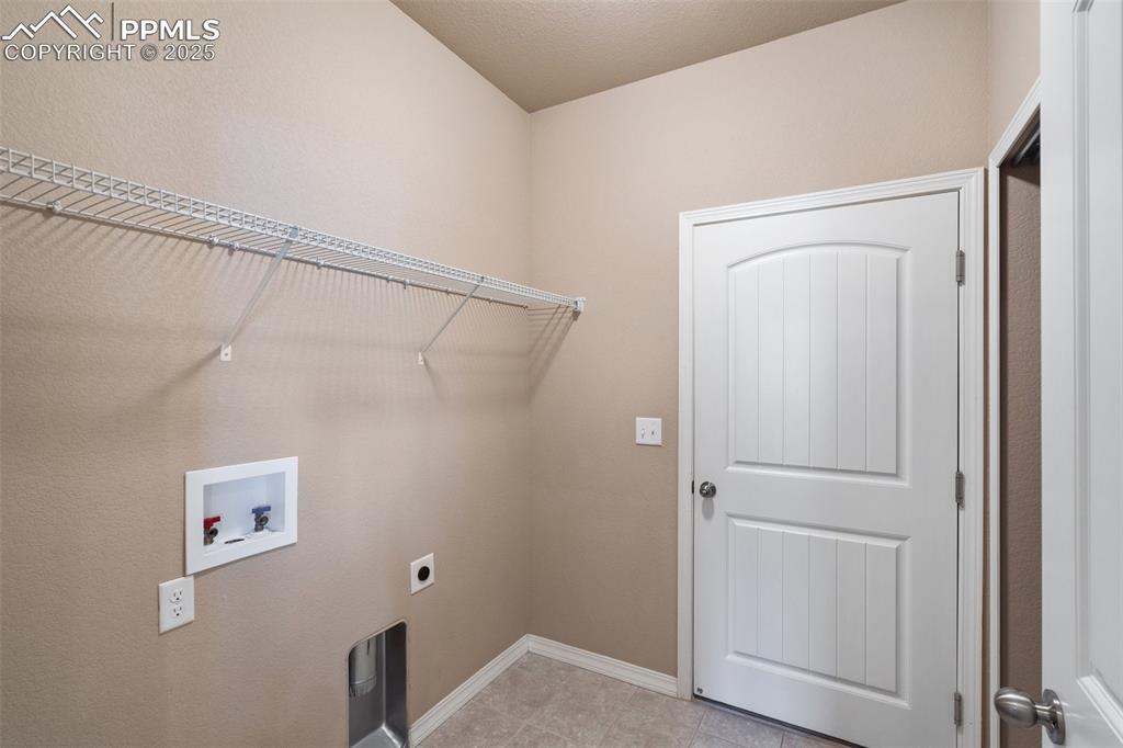 Image 24 of 45: Laundry area featuring hookup for a washing machine and hookup for an elect