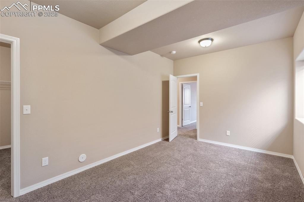 Image 34 of 45: Basement Bedroom - Carpeted spare room featuring baseboards