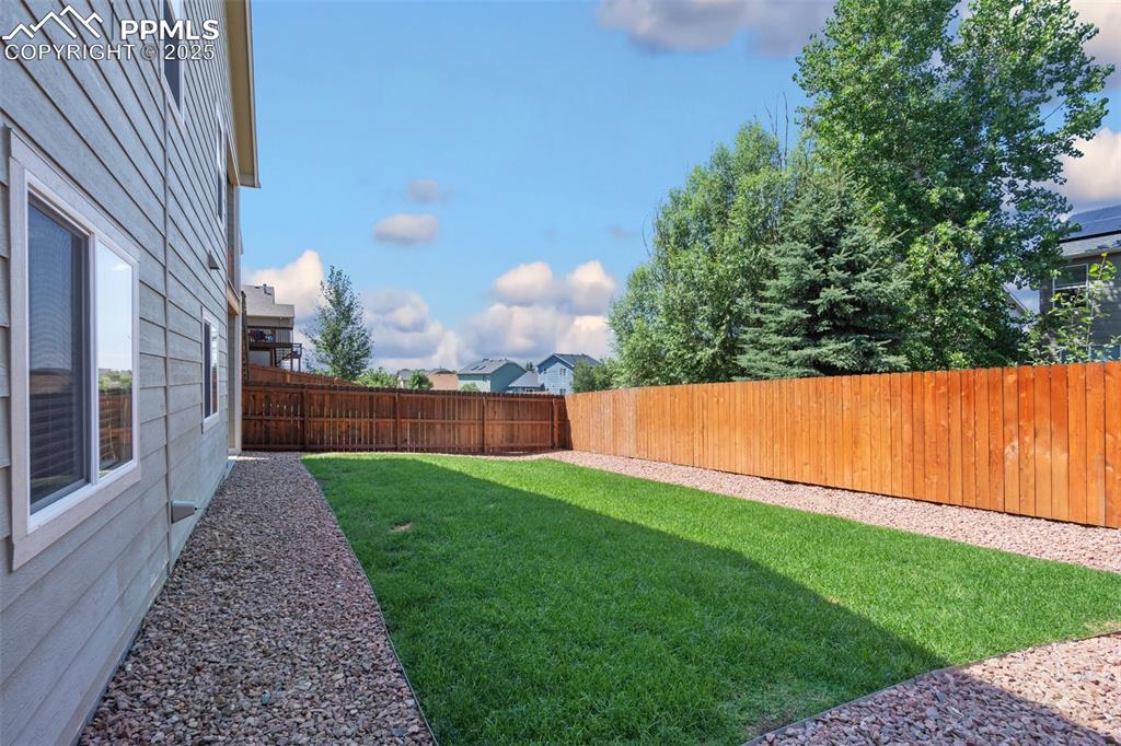 Image 38 of 45: View of fenced backyard