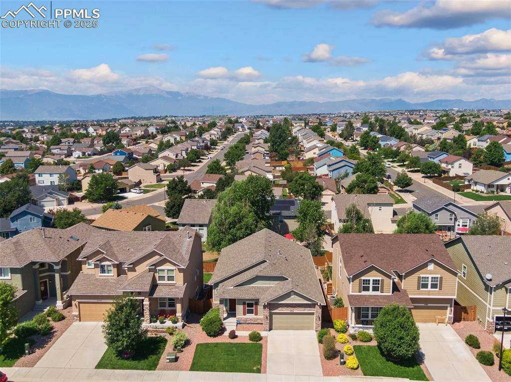 Image 44 of 45: Aerial view of residential area with mountains