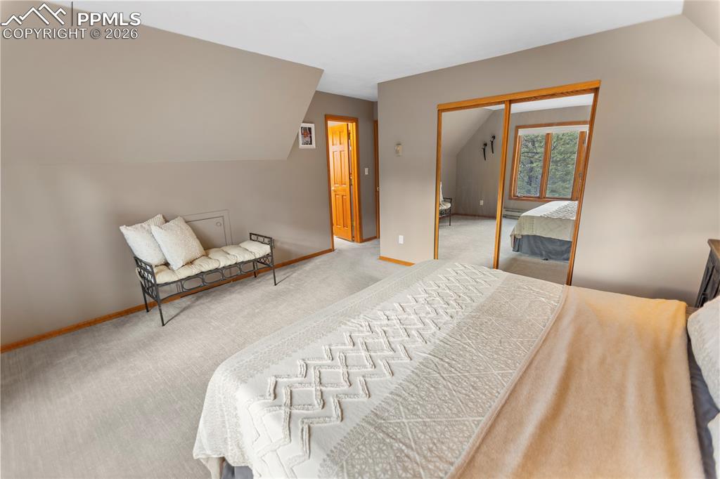 Image 22 of 37: Upper Level Master Bedroom