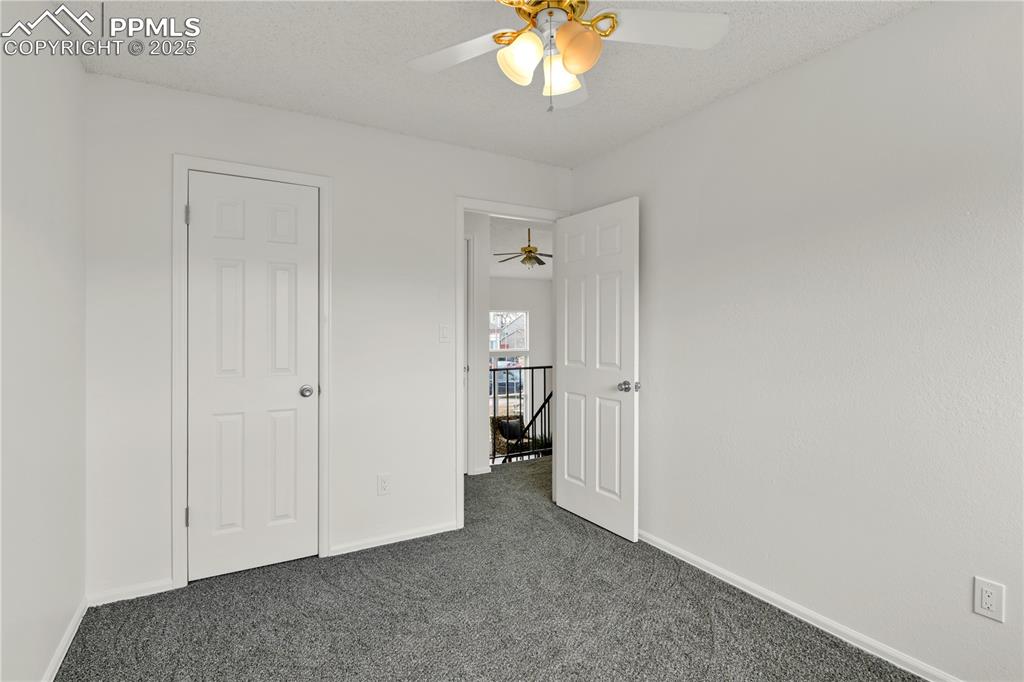 Image 17 of 28: Another view of bedroom 2 on the upper level featuring brand new carpet, pa