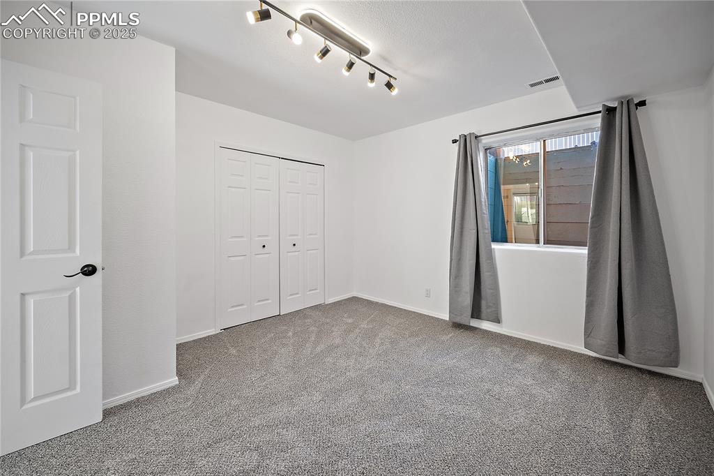 Image 18 of 42: Spacious lower level bedroom 