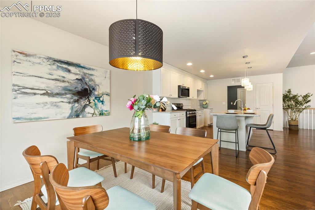 Image 16 of 44: Alternate view of the primary suite with view of backyard