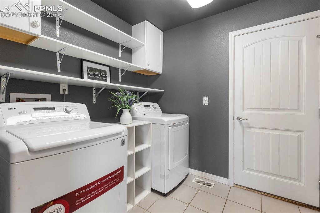 Image 17 of 44: Primary bathroom featuring a soaking tub, walk-in shower with glass enclosu