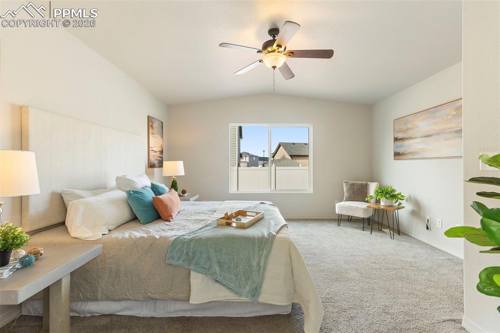 Image 20 of 44: Custom double walk-in closet featuring built-in drawers, shelving, and hang