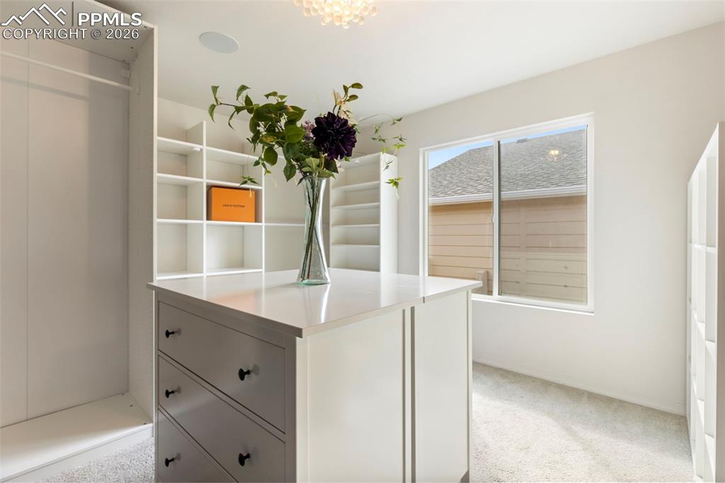 Image 24 of 44: Main floor full bathroom adjacent to bedroom  with tub/shower combination, 