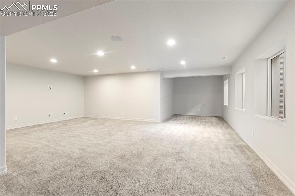 Image 30 of 44: Virtually Staged lower level flex space