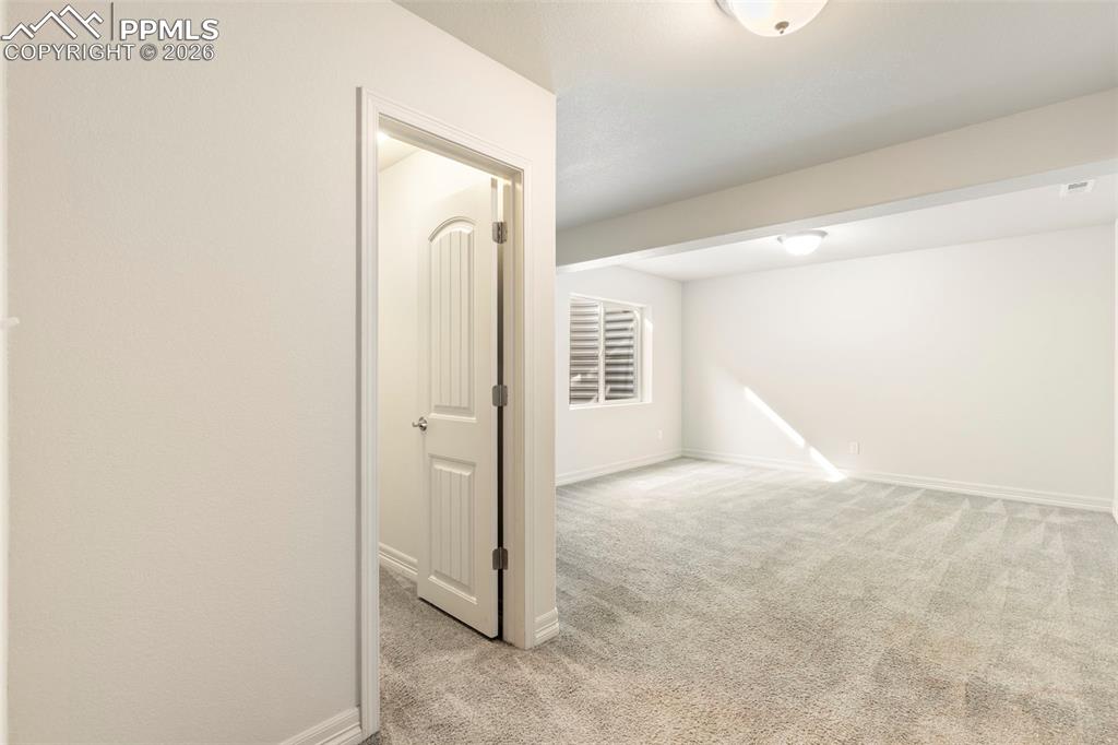 Image 35 of 44: Finished basement bedroom with carpeted flooring, recessed lighting, and eg