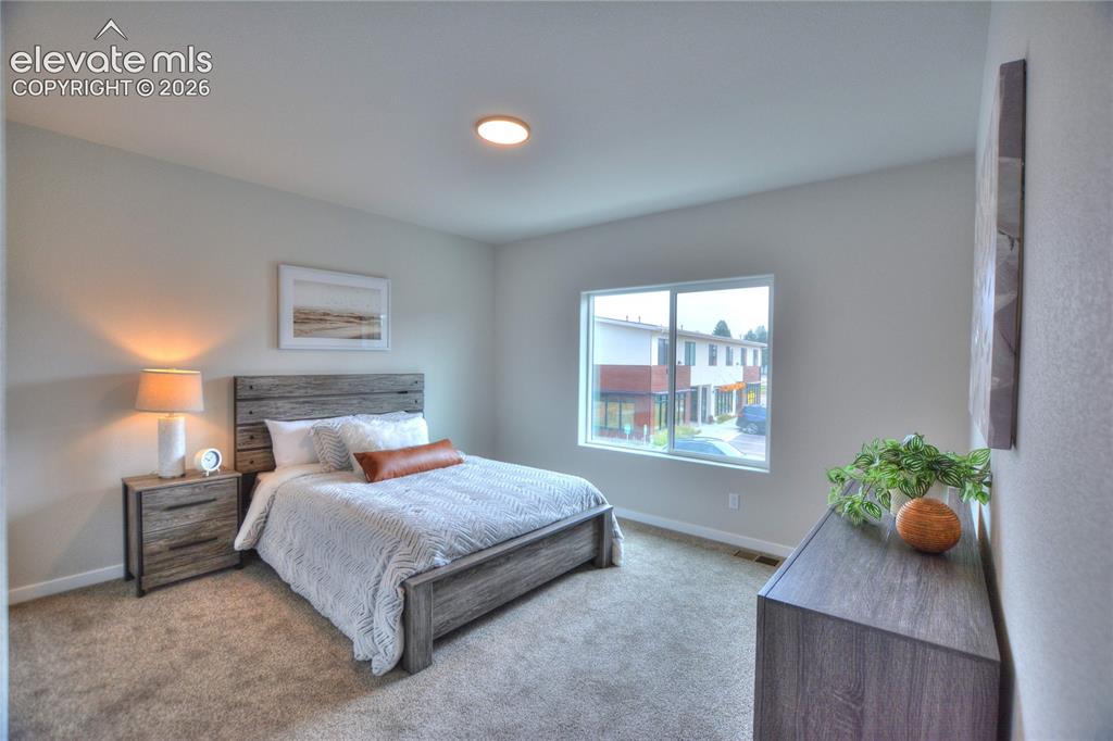 Image 17 of 25: Wall-to-wall carpeting and a recessed ceiling light fixture