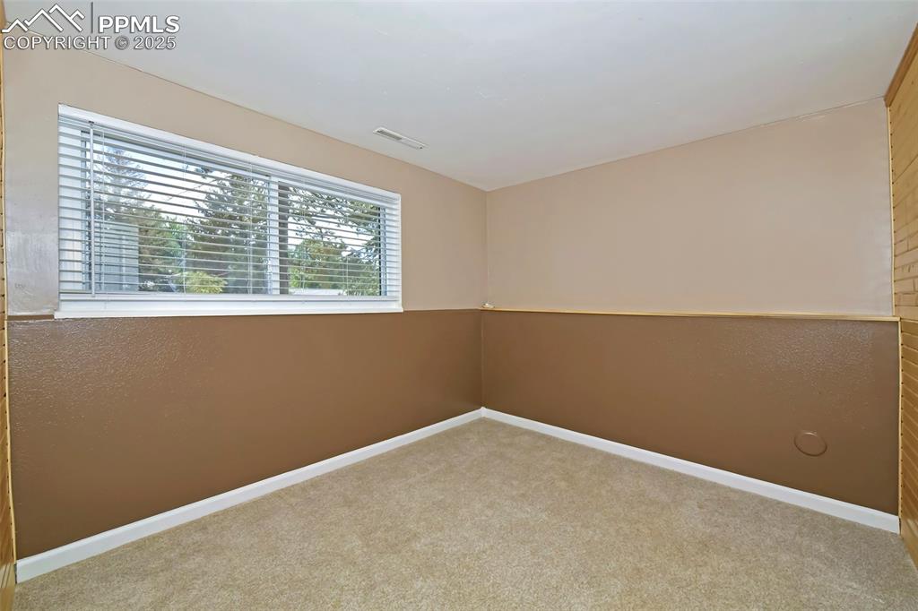 Image 27 of 39: Carpeted empty room featuring baseboards