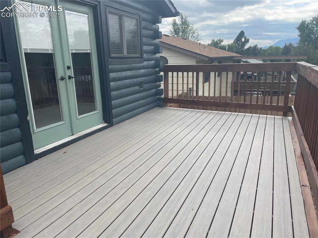 Image 34 of 39: Deck featuring french doors