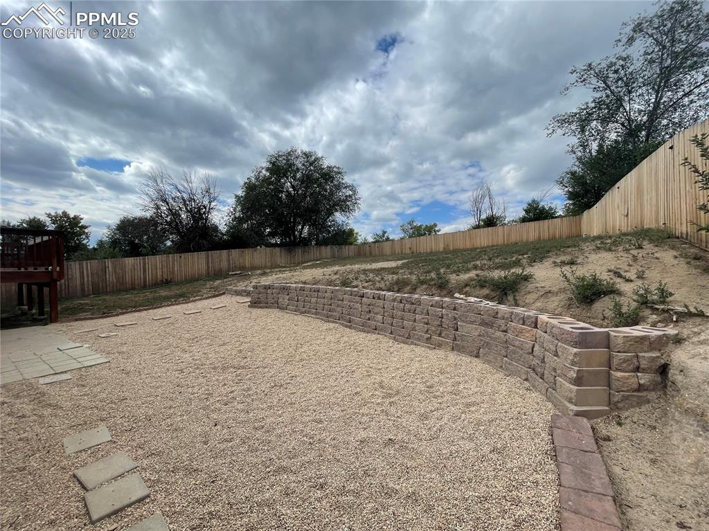 Image 39 of 39: View of fenced backyard