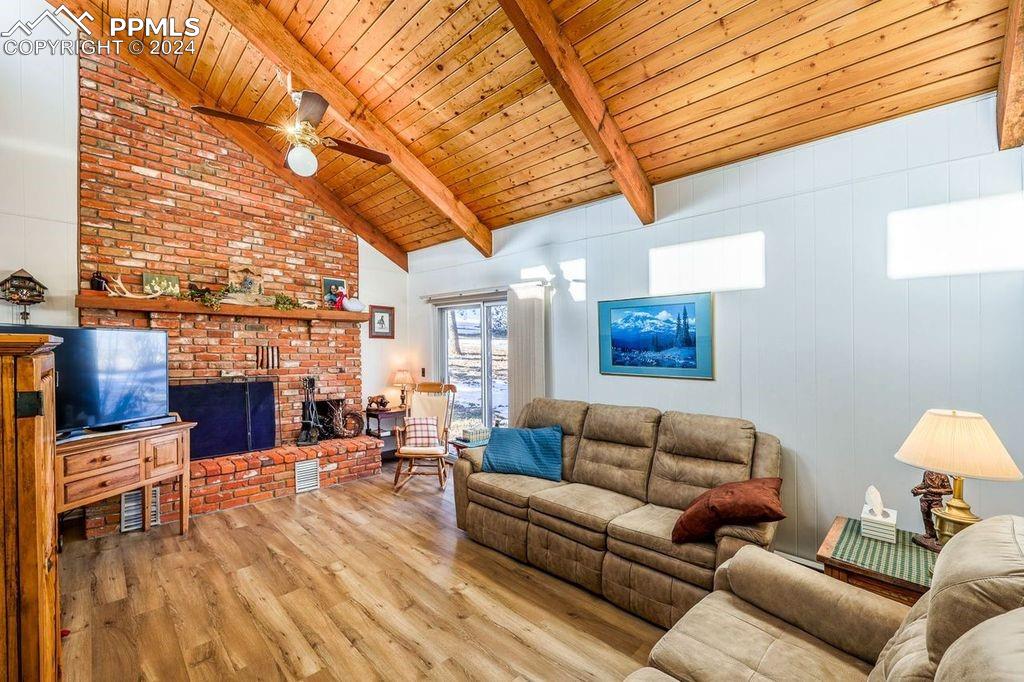 Image 25 of 50: Main floor Great Room with fireplace! Cozy!