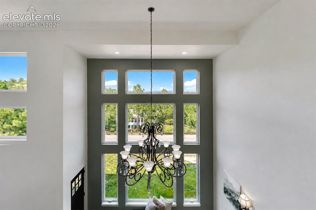 Image 27 of 49: Sensational views from the dramatic floor to ceiling window in the Living R
