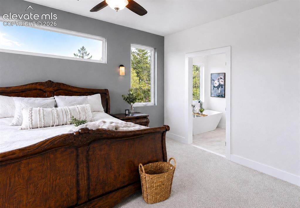 Image 30 of 49: Primary Bedroom into the adjoining 5-piece Primary Bathroom.