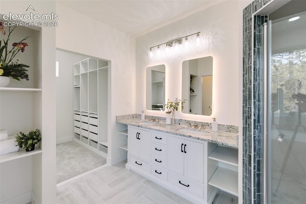 Image 31 of 49: Luxurious 5-piece spa bathroom with dual sink vanity with quartz countertop