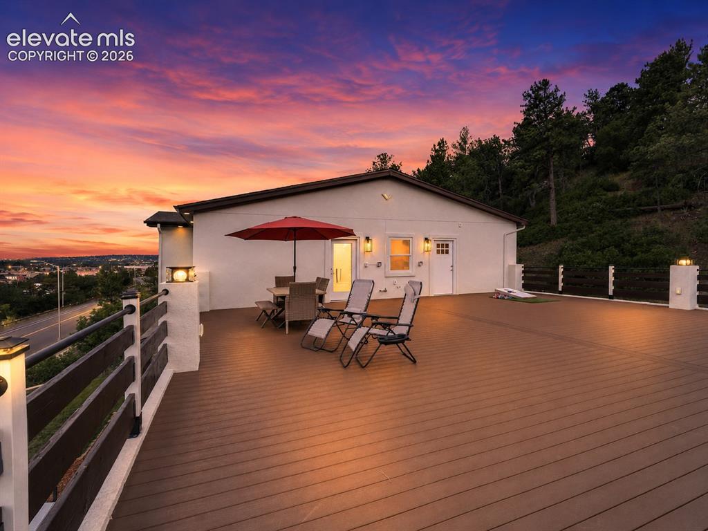 Image 42 of 49: A massive 40x40 composite deck extends the home