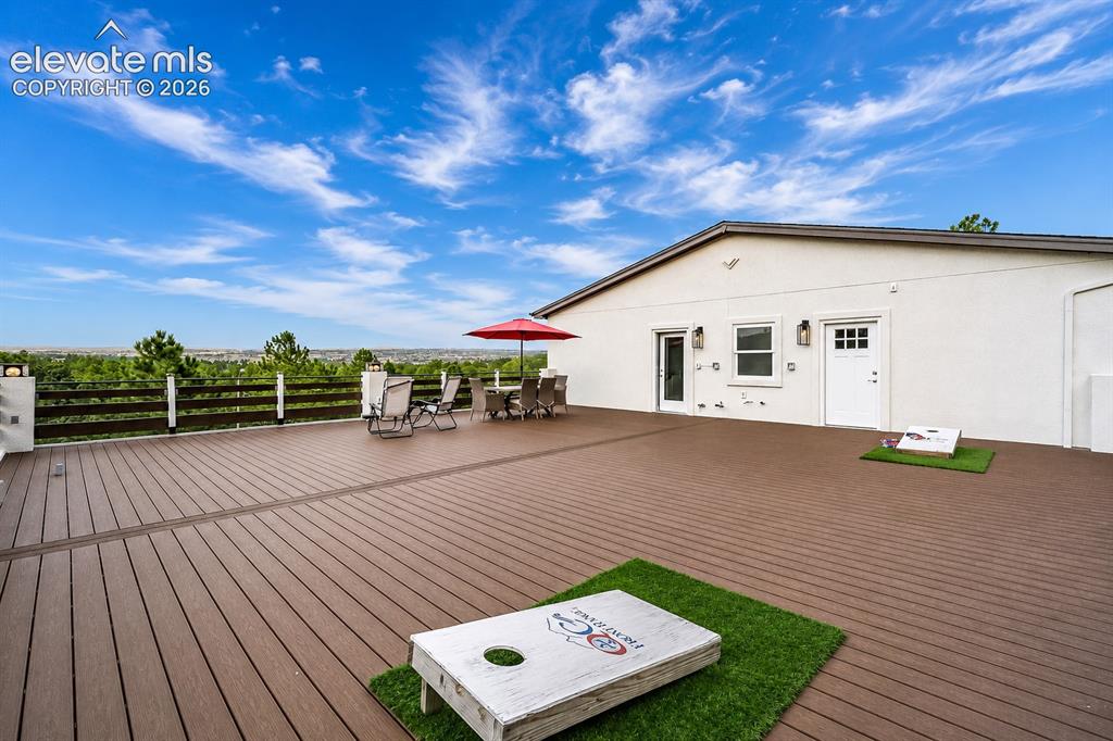 Image 44 of 49: Daytime view of deck already plumbed and   reinforced for a future hot tub,