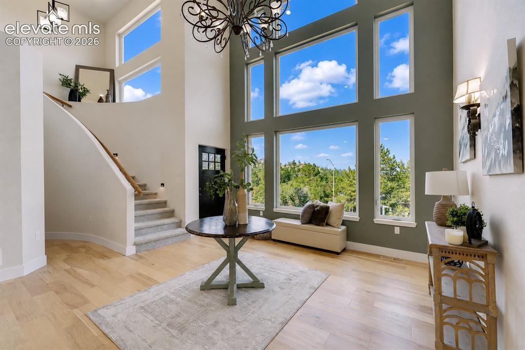 Image 8 of 49: Dramatic floor to ceiling windows with amazing views in the Living Room.