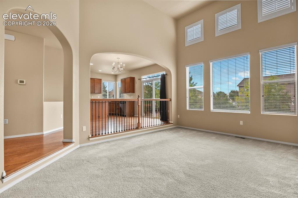 Image 9 of 50: Vaulted ceilings with high windows, creating an expansive space