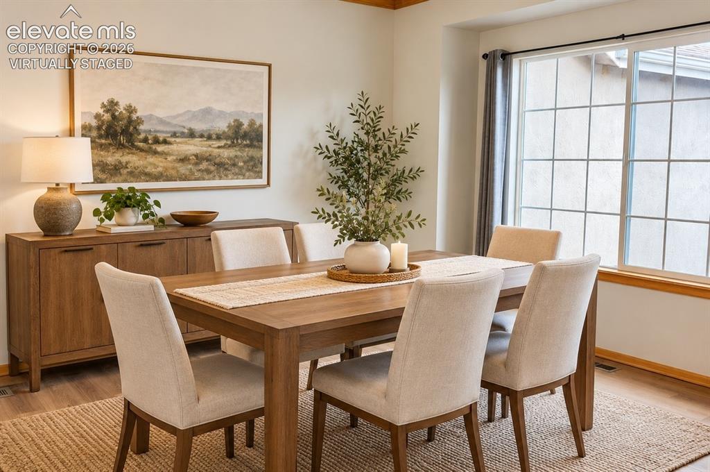 Image 10 of 48: Wood-finish flooring, off the kitchen area with bright windows. Virtually S