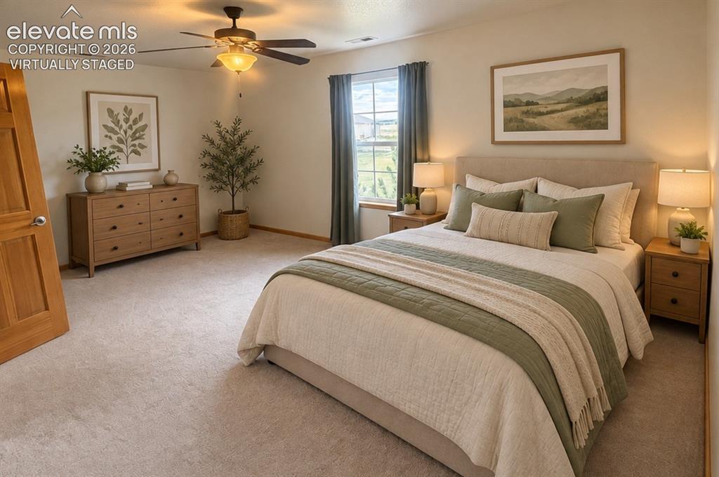 Image 29 of 48: Upstairs bedroom 3/3.Lg walk-in closet. Carpeted room featuring a ceiling f