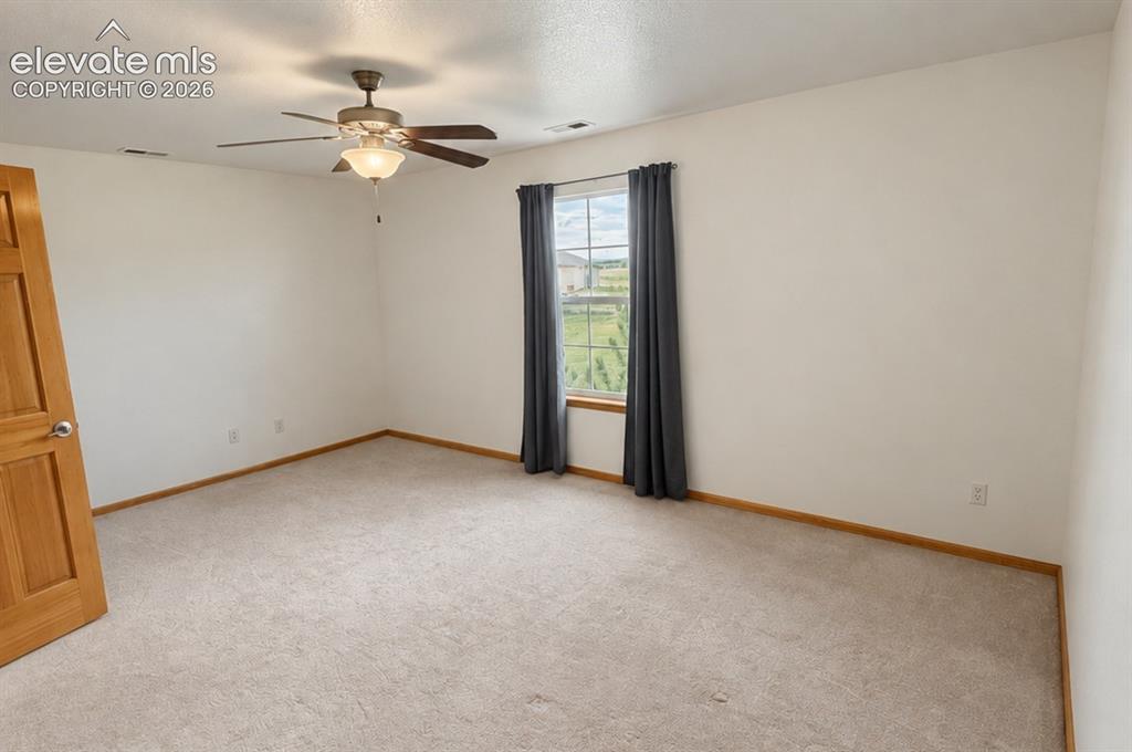 Image 30 of 48: Upsatairs bedroom 3/3. Recessed lighting, ceiling fan with integrated light