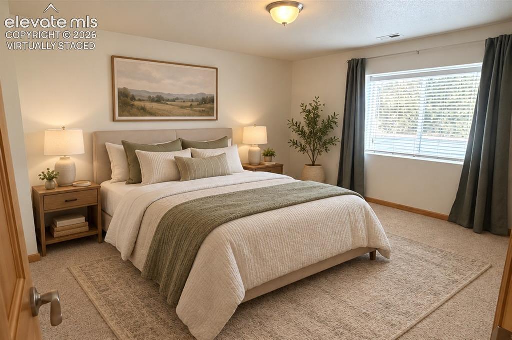 Image 35 of 48: Basement bedroom 1/2. Carpeted flooring, window with blinds and drapes, cei