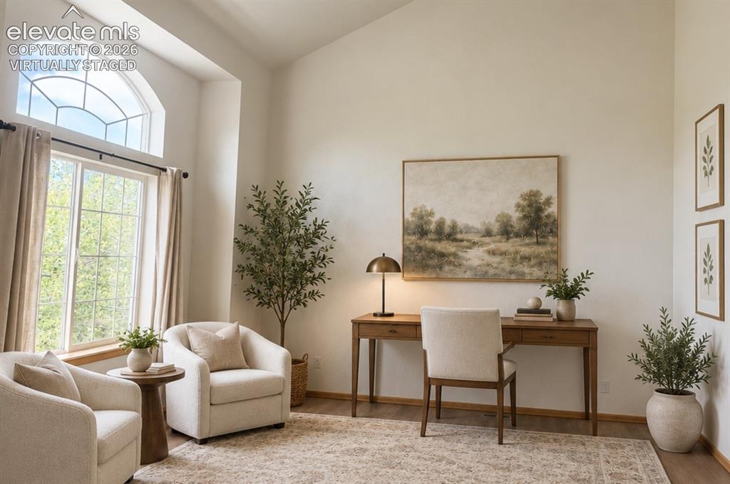 Image 8 of 48: Entry open space with Vaulted ceiling with an arched transom window. Neutra