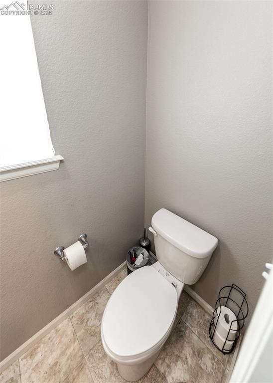 Image 18 of 40: Bathroom with toilet and baseboards