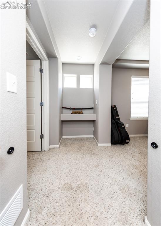 Image 21 of 40: Hallway with baseboards