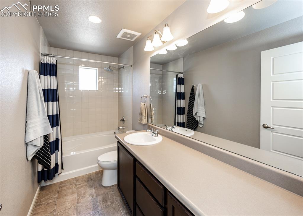 Image 32 of 40: Full bath with vanity and shower / tub combo