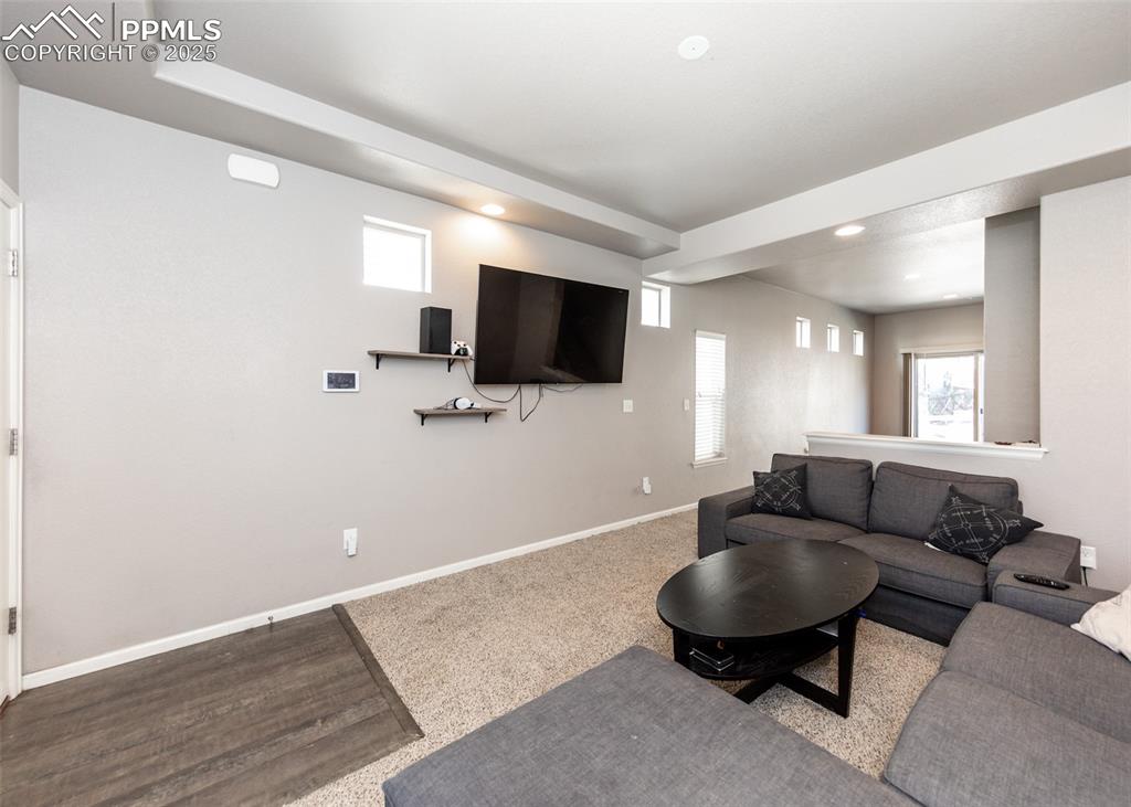 Image 5 of 40: Living area with recessed lighting