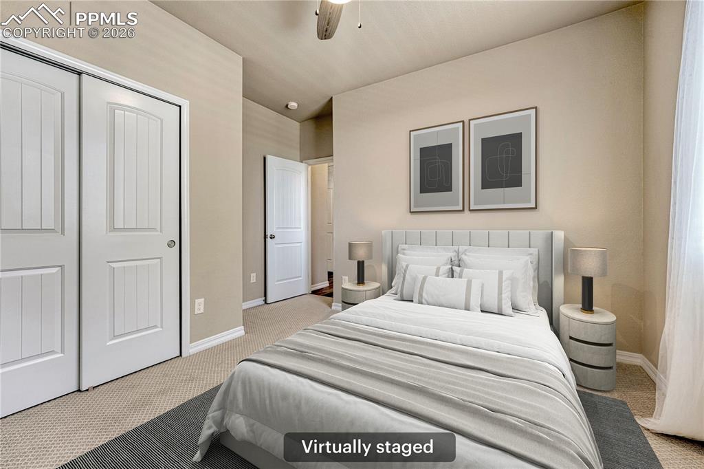 Image 27 of 42: The room features light-colored walls and carpeting, white trim, and a ceil