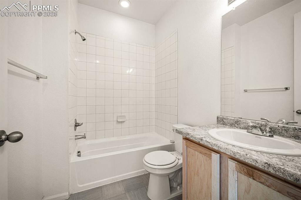 Image 9 of 25: Full bath with vanity and shower / tub combination