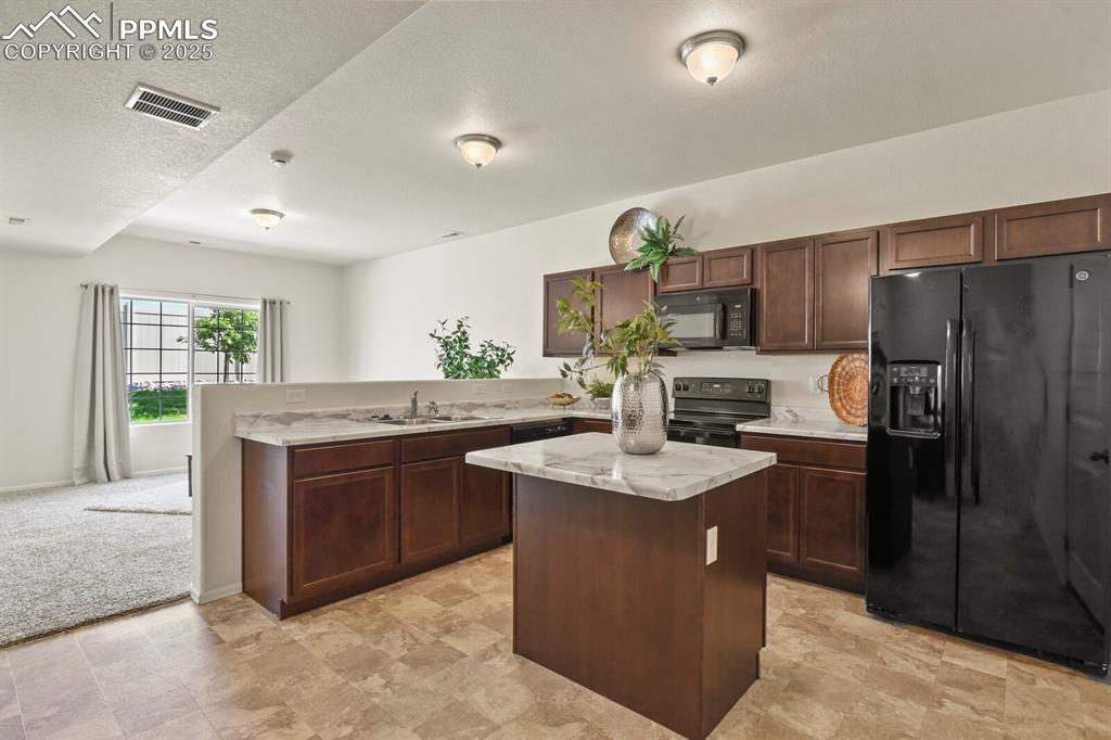 Image 10 of 36: Kitchen with center island