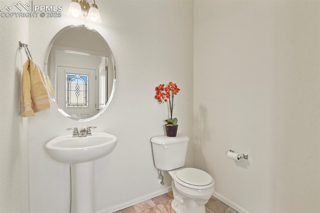 Image 17 of 36: Large main floor half bath