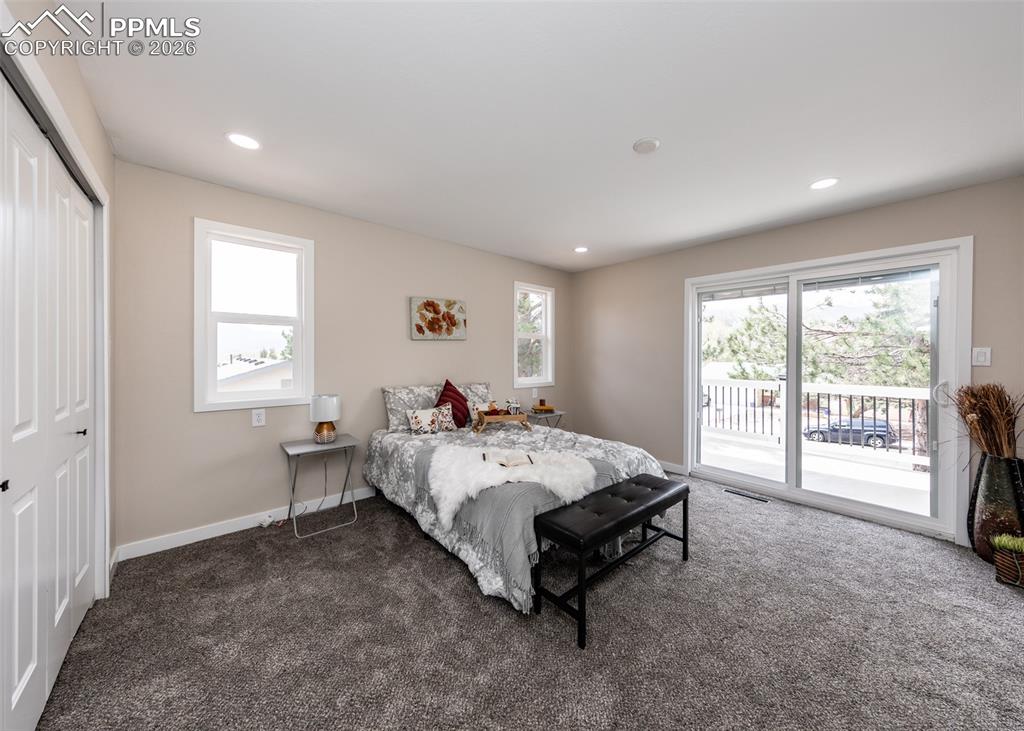 Image 19 of 48: Bedroom with carpet floors, access to exterior, a closet, recessed lighting