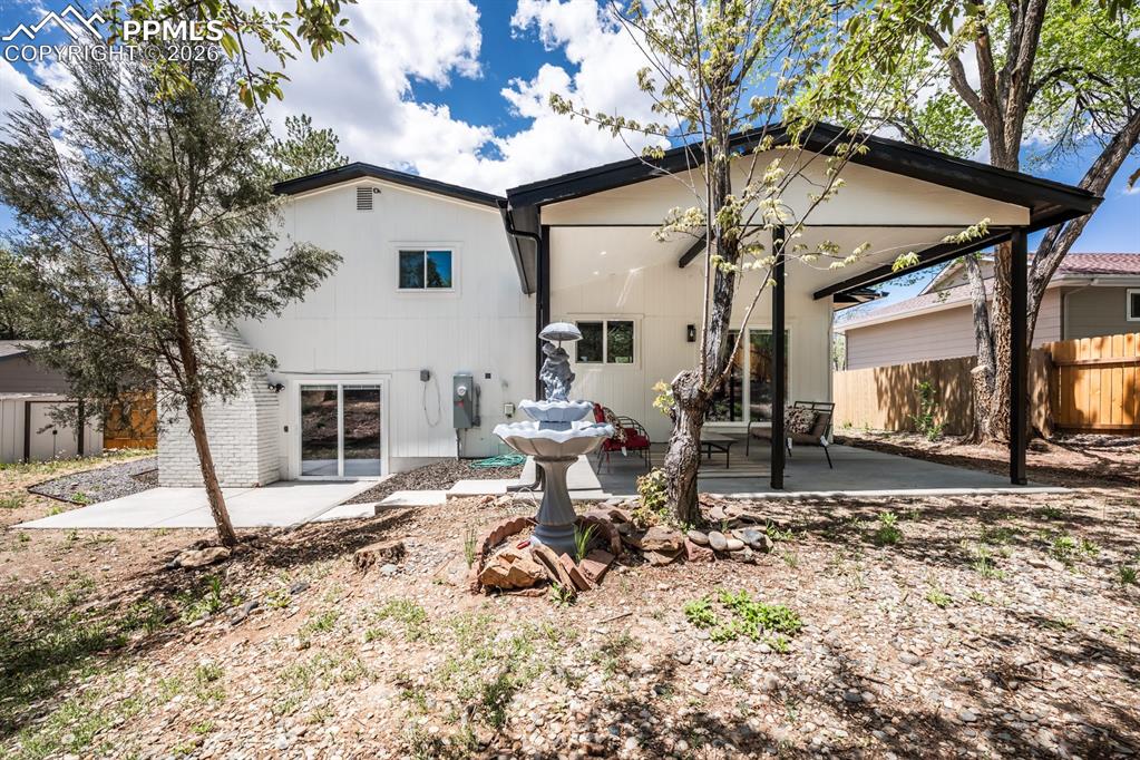 Image 47 of 48: Back of property with a patio area