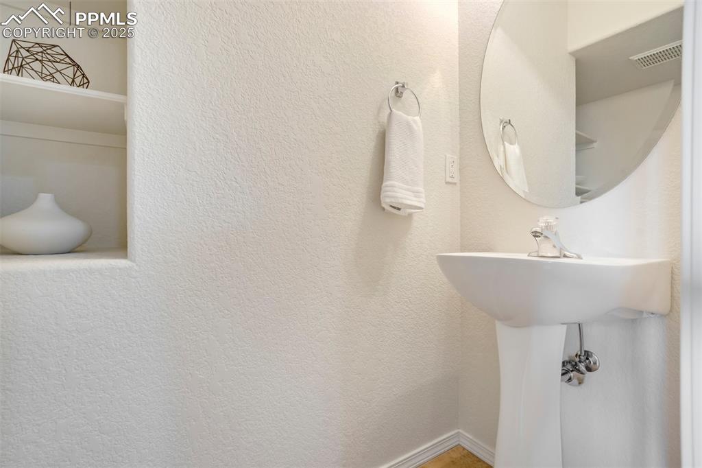 Image 12 of 29: Main level powder room