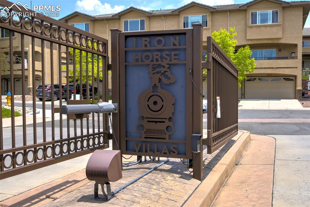 Image 24 of 29: Gated entry to Iron Horse Villas