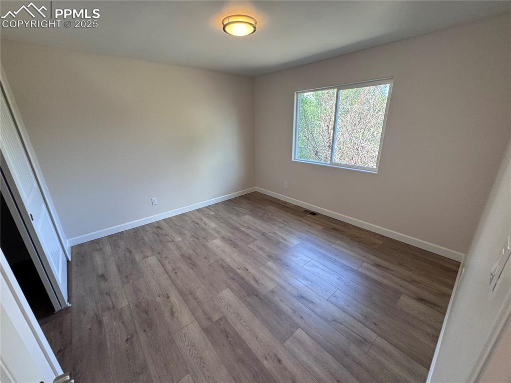 Image 17 of 36: Unfurnished bedroom featuring a closet and light wood finished floors