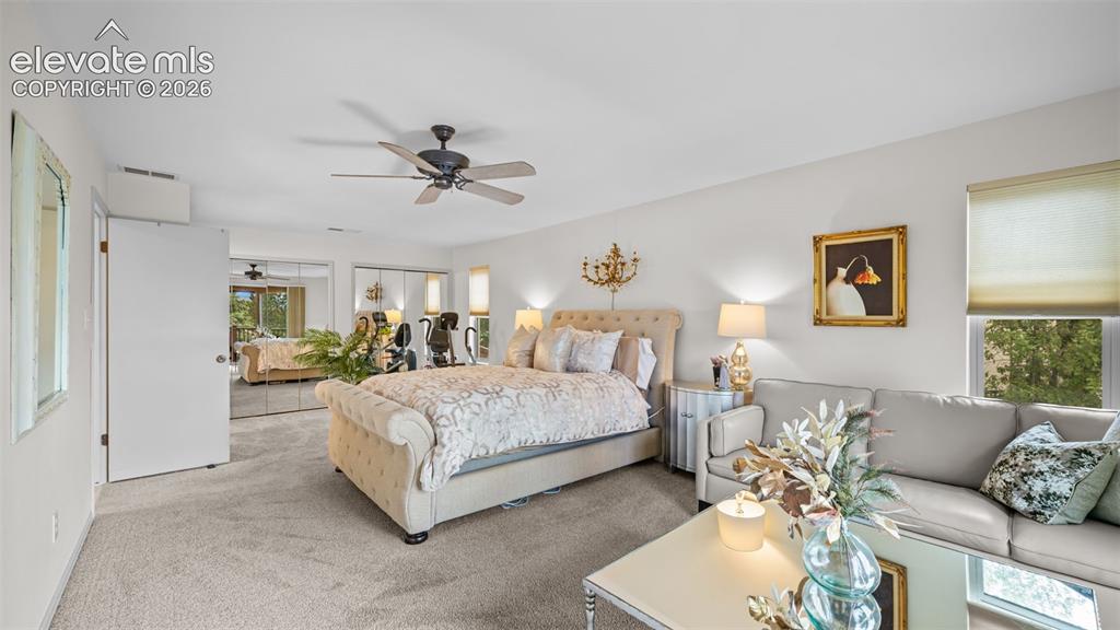 Image 10 of 50: Spacious room with light neutral carpet flooring, a ceiling fan, and recess