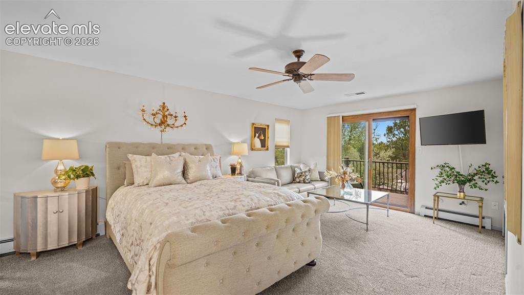 Image 13 of 50: Spacious room featuring light-colored carpeting, a ceiling fan, and a glass