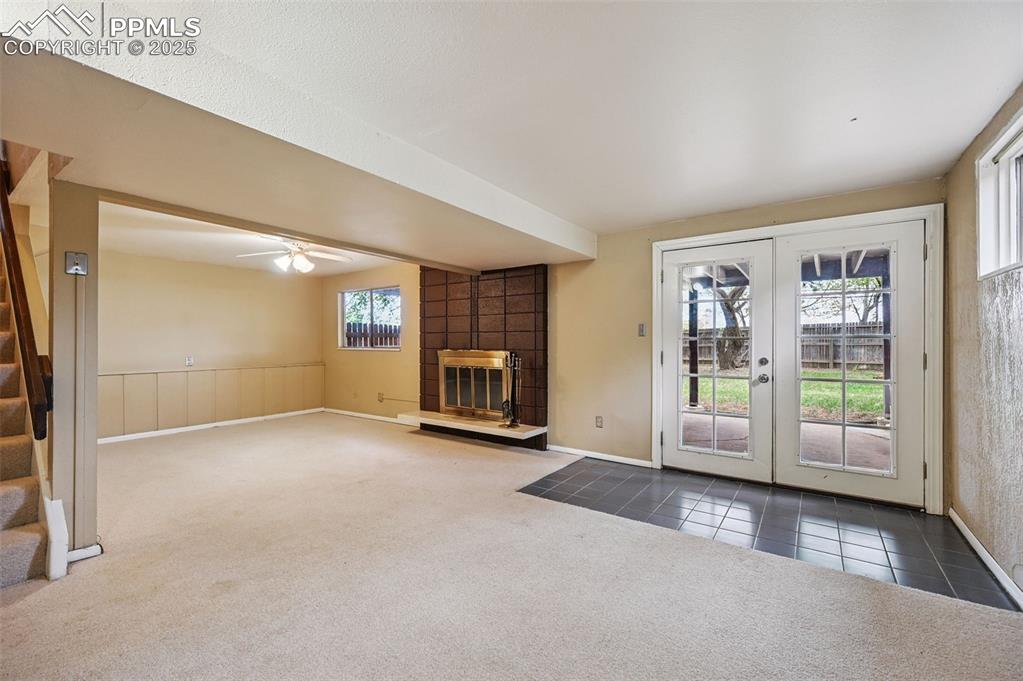 Image 19 of 44: Family room in basement - w/fireplace