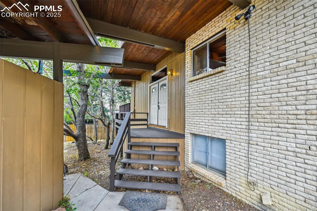 Image 2 of 44: Property entrance w/brick siding